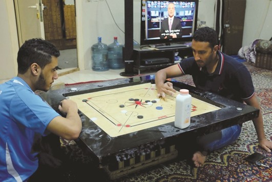 Saudi men play carrom inside a family gathering hall in Dammam on Monday. Saudi net employment rose by only 49,000 in 2015, its slowest annual increase since records began in 1999. That is far short of the 226,000 jobs that the economy must create each year to accommodate new entrants to the labour market, according to a February report by Riyadh-based Jadwa Investments.
