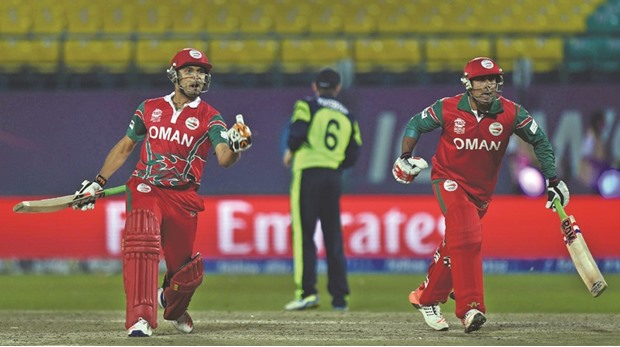 Omanu2019s Munis Ansari (right) and Ajay Lalcheta react after their teamu2019s upset victory over Ireland in the World T20 cricket tournament match at the Himachal Pradesh Cricket Association Stadium in Dharamsala, North India, yesterday. (AFP)