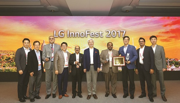 Video Home and Jumbo Electronics CEO C V Rappai and other officials are seen with LGu2019s Kevin Cha, Y G Choi and S H Park and others after receiving the awards in Barcelona.