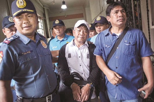 Edgar Matobato, 57, the self-confessed hitman, surrenders to Manila police.