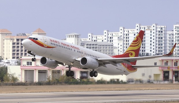 A Hainan Airlines plane takes off from the Sanya Phoenix International Airport. Chinese conglomerate HNA Group, the owner of Hainan Airlines, inked about $20bn in deals last year, snapping up a stake in Hilton Hotels and investing in catering and logistics firms u2013 spending that raised concerns the group was borrowing too heavily and spreading itself too thinly.