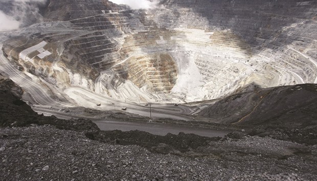 Trucks operate in the open-pit mine of PT Freeportu2019s Grasberg copper and gold mine complex near Timika, in the eastern region of Papua. Indonesian Energy and Mineral Resources Minister Ignasius Jonan is working with Freeport to end the  stalemate, said a senior government official yesterday.