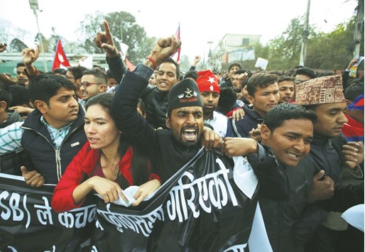 Nepalese students affiliated with the All Nepal National Free Students Union, a student wing of the Communist Party of Nepal Unified Marxist Leninist (CPN-UML), protest near the Indian embassy against the incident in which one Nepali man was killed at the India-Nepal border, in Kathmandu yesterday.