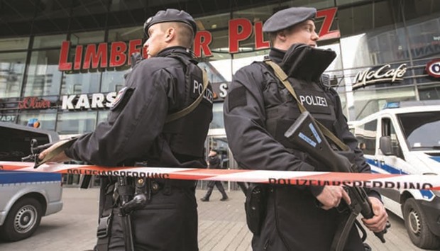 Police officers secure the area around the Limbecker Platz shopping centre in Essen.