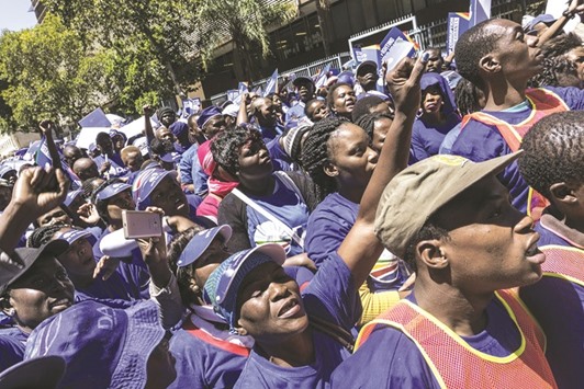 Hundreds of members and supporters of the South African opposition party Democratic Alliance (DA) demonstrate outside the South African Social Development Department in Pretoria.