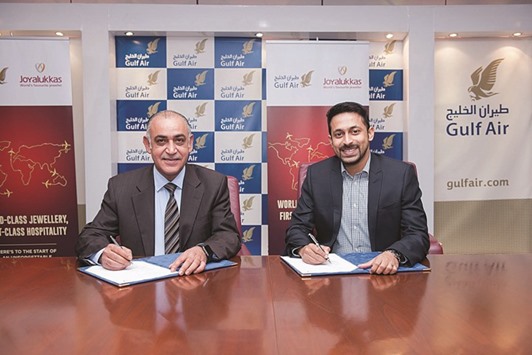 Joyalukkas Group executive  director John Paul Alukkas and Gulf Air chief commercial officer Ahmed Janahi at the partnership agreement signing ceremony.
