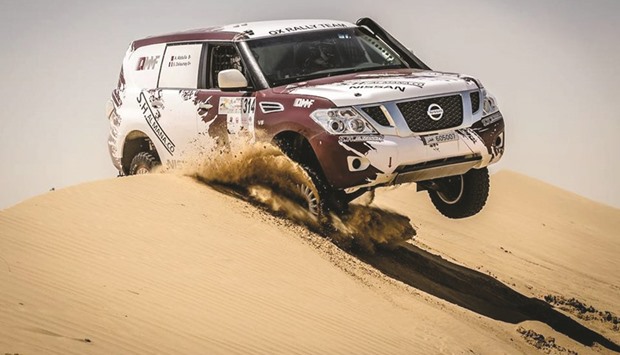 Qataru2019s Adel Abdulla leaps a dune in the Al Qudra desert at the Dubai International Baja yesterday.