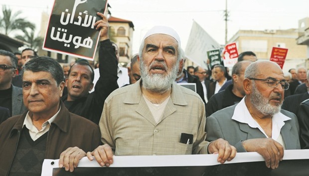 Israeli-Arabs protest against the initial approval of a bill to enforce lowering the volume of mosque loudspeakers calling worshippers to prayer, in the town of Kabul yesterday.