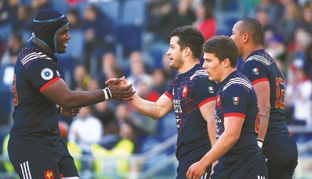 Franceu2019s Brice Dulin (third right) celebrates with teammates after scoring against Italy yesterday. (Reuters)