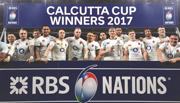Englandu2019s Dylan Hartley and teammates celebrate with the Calcutta Cup yesterday. (Reuters)