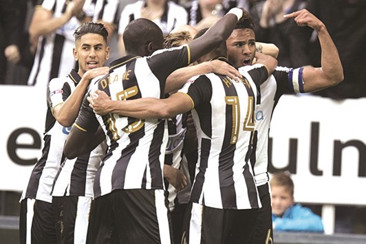 Rafael Benitezu2019s side climb above Brighton into first place in the second tier table thanks to a two-goal burst in the final 9 minutes.