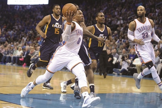 Oklahoma City Thunder guard Russell Westbrook drives to the basket in front of Utah Jazz guard Alec Burks (No 10) during the second quarter of their NBA game at Chesapeake Energy Arena. PICTURE: USA TODAY Sports