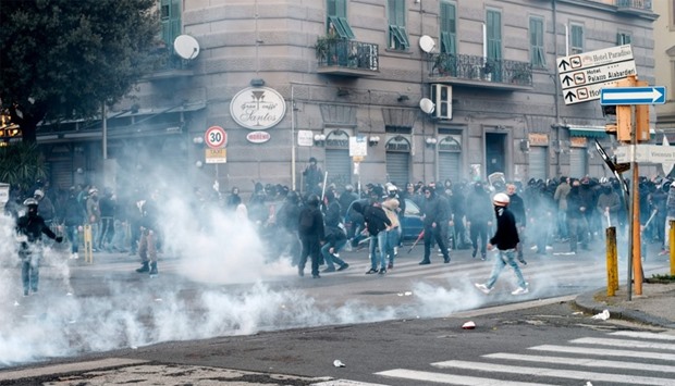 A group of people clashes with police in Fuorigrotta district
