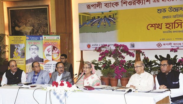 Prime Minister Sheikh Hasina inaugurating disbursement of primary education stipends using mobile banking accounts of mothers of students from her residence in Dhaka yesterday.