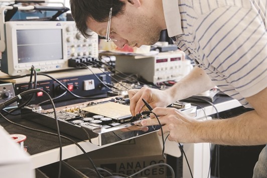 An engineer connects a Devialtet amplifier to an oscilloscope at the Analogue Digital Hybrid amplification technology companyu2019s headquarters in Paris. The IHS Markit eurozone manufacturing Purchasing Managersu2019 Index rose to 55.4 in February u2014 the highest reading since April 2011 u2014 from 55.2 in January, although it inched down from a flash estimate of 55.5.