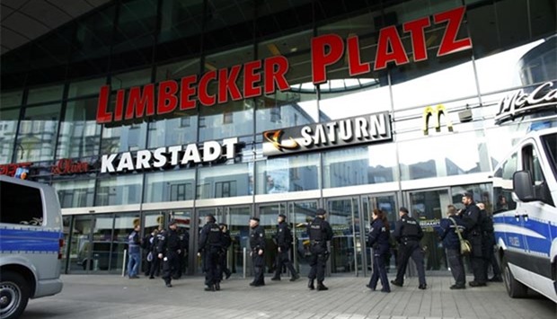 Police at the entrance of Limbecker Platz shopping mall in Essen, Germany, after it was shut due to attack threat.