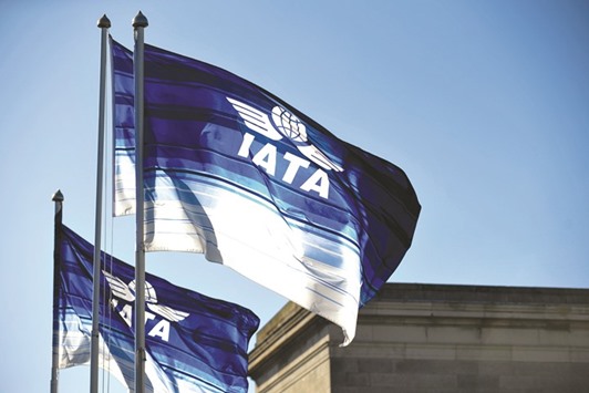 Flags featuring the IATA logo fly above the venue of a symposium in Dublin, Ireland, on June 2, 2016. In 2016, nearly 3.8bn travellers flew safely on 40.4mn flights, IATA says.