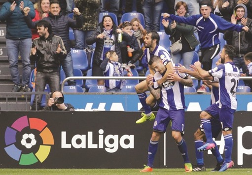 Deportivou2019s Joselu Mato is congratulated by teammates after scoring against Barcelona yesterday.
