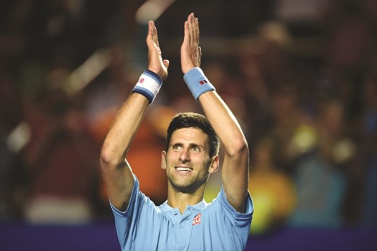Serbian star Novak Djokovic celebrates his victory over Martin Klizan on the second day of the Mexican Tennis Open in Acapulco, Guerrero state, Mexico. (AFP)