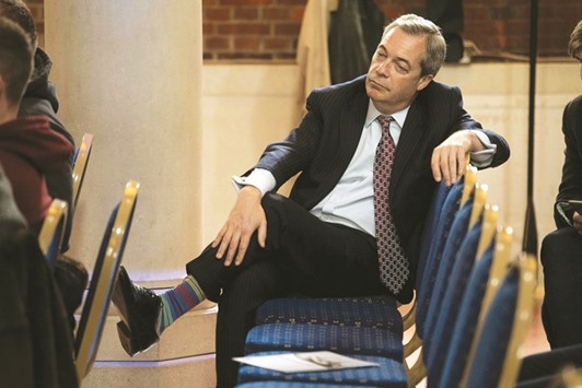 Ukip leader Nigel Farage sits in the audience during a press conference in London.