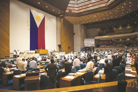 Congressmen vote vocally for the passage of the death penalty at the House of Representatives in Manila yesterday. The lower house of the Philippine parliament voted on the passage of a bill reimposing the death penalty for narcotics trafficking.