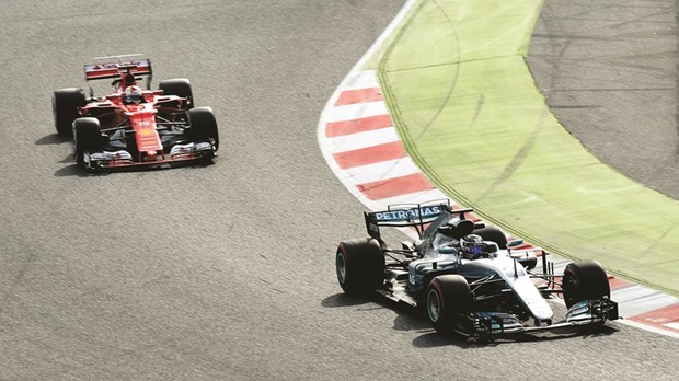 Mercedesu2019 Valterri Bottas (right) is followed by Ferrariu2019s Sebastian Vettel during the Formula 1 testing session at Circuit de Catalunya in Montmelo, Spain, yesterday. (Reuters)