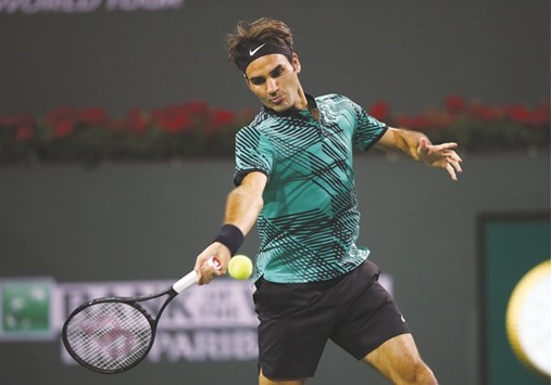Roger Federer of Switzerland plays a forehand during his straight sets victory against Stephane Robert of France in their second round match of the BNP Paribas Open at Indian Wells Tennis Garden in Indian Wells, California. (Getty Images/AFP)