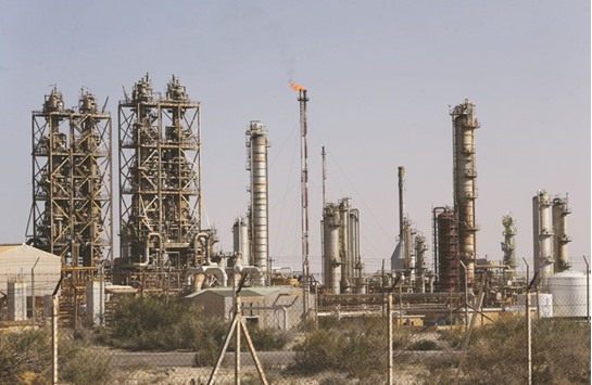 Pipelines are seen at the industrial zone at the oil port of Brega, Libya. A senior official at National Oil Corp warned yesterday of a possible declaration of force majeure at the Es Sider and Ras Lanuf oil terminals as air strikes continued and rival forces mobilised fighters in the area.