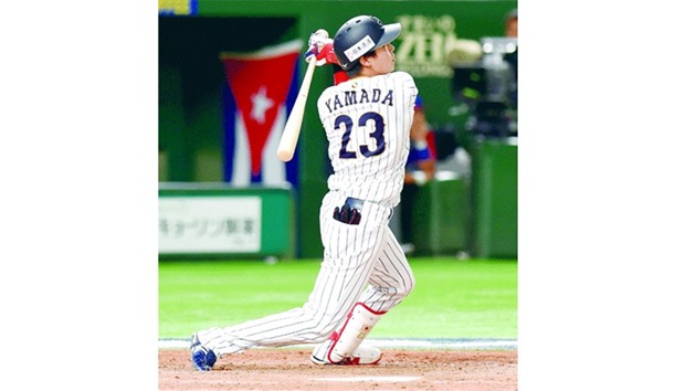Japanese designated hitter Tetsuto Yamada hits a two-run homer in bottom of the eighth inning during the World Baseball Classic Pool E second round match against Cuba. (AFP)
