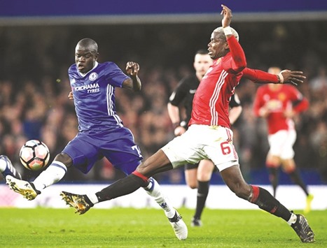 Chelseau2019s French midfielder Nu2019Golo Kante (L) vies with Manchester Unitedu2019s French midfielder Paul Pogba during the FA Cup tie.