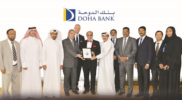 Doha Bank CEO Dr R Seetharaman and other dignitaries with the u2018Best Trade Finance Banku2019 in Qatar award.