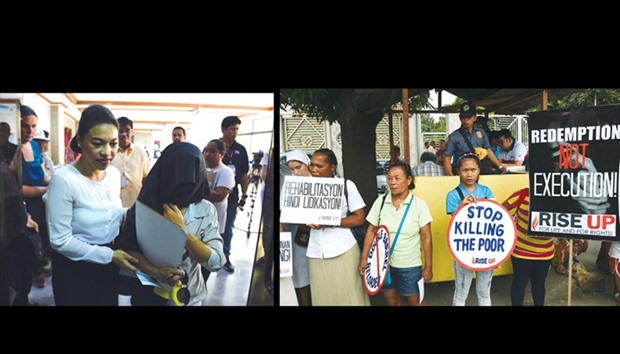 A woman (right), who asked not to be identified in fear of potential police retribution and using the pseudonym u201cSally Antoniou201d, walks with her lawyer at the office of the anti-graft body in Manila yesterday, to file a complaint against policemen allegedly involved in the killing of her husband and eldest son.  RIGHT: A policeman (back) watches protesters and relatives as they hold a rally outside the office of the anti-graft body in Manila yesterday.