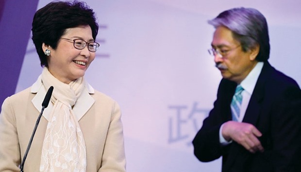 Two of Hong Kong leadership candidates John Tsang (right) and Carrie Lam attend the first televised debate at a studio in Hong Kong.