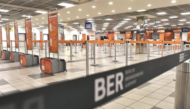 Deserted check-in desks are seen at Berlinu2019s Schoenefeld airport  during strike action by ground staff.