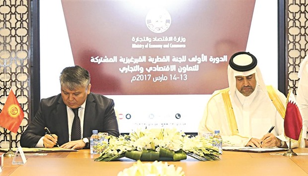 HE the Minister of Economy and Commerce Sheikh Ahmed bin Jassim bin Mohamed al-Thani and the Minister of Economy of Kyrgyzstan Arzybek Kozhoshev signing the minutes of the meeting of the Qatari-Kyrgyz Joint Committee on Economic, Commercial and Technical Co-operation, which concluded in Doha yesterday.