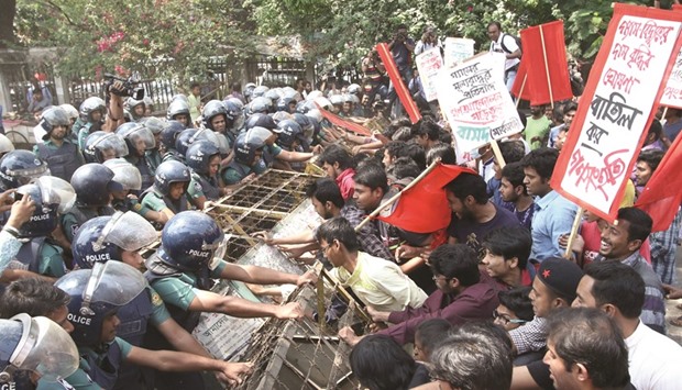 Protesters try to break the police barricade during their march towards the ministry of power, energy and mineral resources in Dhaka yesterday.