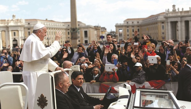 Pope Francis leaves at the end of his general audience yesterday in Saint Peteru2019s Square at the Vatican.
