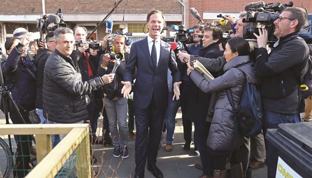 The Netherlandsu2019 Prime Minister Mark Rutte arrives to cast his ballot at a polling station in The Hague.