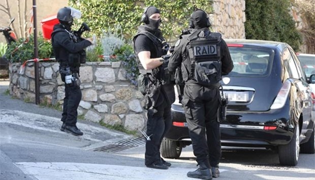 Members of the RAID (Search, Assistance, Intervention, Deterrence) French police unit stand near the Tocqueville high school in the southern French town of Grasse, on Thursday following a shooting