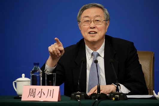 Zhou Xiaochuan, governor of the Peopleu2019s Bank of China, attends a news conference in Beijing. The PBoC strengthened the yuanu2019s daily mid-point reference rate by the most in about two months yesterday.