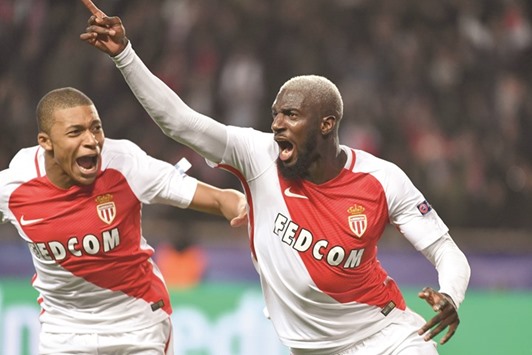 Monacou2019s midfielder Tiemoue Bakayoko (right) celebrates with teammate Kylian Mbappe Lottin after scoring a goal during the UEFA Champions League round of 16 match against Manchester City at the Stade Louis II in Monaco on Wednesday night. (AFP)