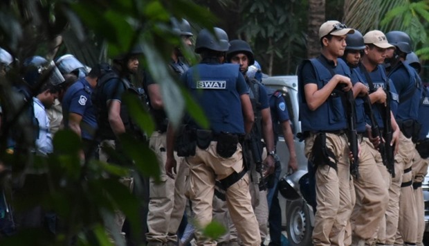 SWAT team prepare to storm a hideout of suspected extremists at Chittagong