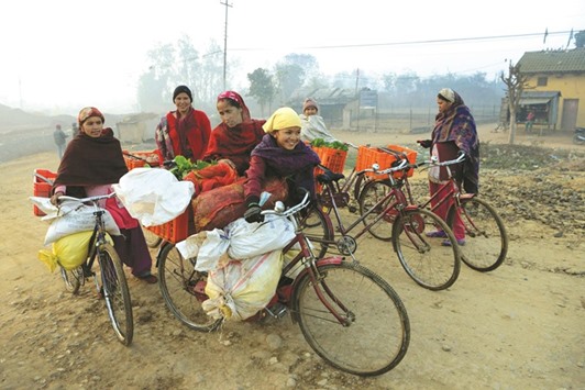 Vegetable vendors arrive to sell vegetables at a market in Birendranagar of Surkhet district, some 520km west of Kathmandu.