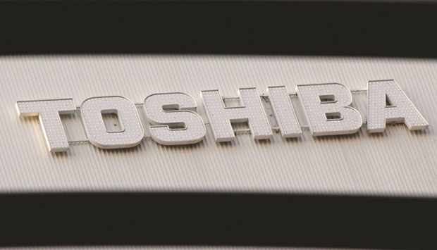 A logo of Toshiba Corp is seen outside an electronics retail store in Tokyo. The Japanese firm missed submitting audited third-quarter earnings for a second time and said it would consider selling a majority stake in Westinghouse which is at the centre of its financial troubles.