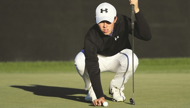 Matthew Fitzpatrick of England lines up a putt on the ninth green during the first round of the Arnold Palmer Invitational.
