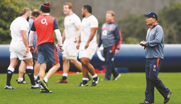 Englandu2019s head coach Eddie Jones (R) takes a team training session at Pennyhill Park in Bagshot, west of London, yesterday.