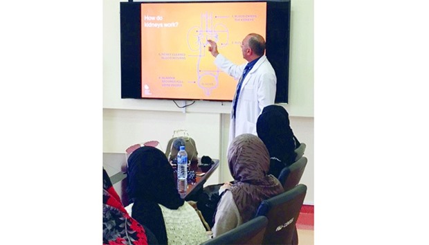 Dr Mohamed Amin Elesnawi briefs QU students during their visit to the Fahad Bin Jassim Kidney Centre.