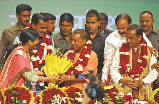 Yogi Adityanath is greeted after he was elected as Uttar Pradesh chief minister, in Lucknow yesterday.