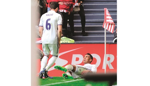 Real Madridu2019s Brazilian midfielder Carlos Henrique Casemiro (R) celebrates after scoring his teamu2019s second goal against Athletic Club Bilbao in Bilbao yesterday.