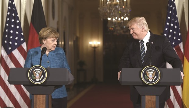 US President Donald Trump and German Chancellor Angela Merkel hold a joint press conference in the East Room of the White House in Washington, DC, on Friday.
